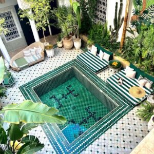 Riad courtyard with green zellige pool in Marrakech